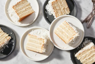 Slices of Coconut Layer Cake on plates