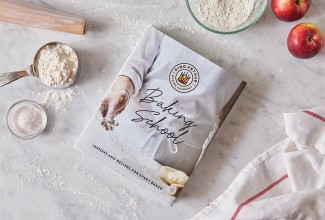 Baking School cookbook on a baking work surface
