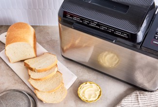 Bread Machine Sourdough Bread next to a bread machine