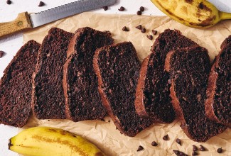 Double Chocolate Banana Bread sliced on a cutting board