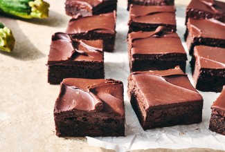 Zucchini Brownies cut into pieces and on a counter
