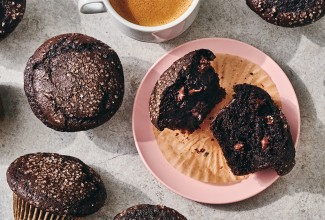 A Chocolate Breakfast Muffin broken open on a plate