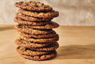 Side photograph of a stack of Cape Cod Soft Molasses Cookies.