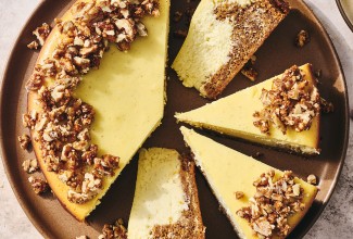 Carrot Cake Cheesecake with golden creamy cheesecake and edged with walnuts.