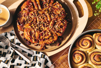 Overhead view of finished sticky buns and their unfinished counterparts.