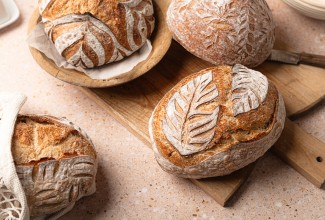 Loaves of sourdough with intricate scoring designs