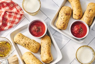 Cheese Stuffed Breadsticks arranged on plates.