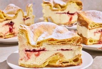 Karpatka Cake on plates showing the layers of cake and filling.