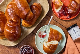 Salt Bread arranged on a table with jelly.