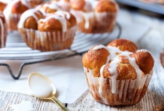 Glazed Cinnamon Apple Pull-Apart Rolls, fresh from the oven on a plate.