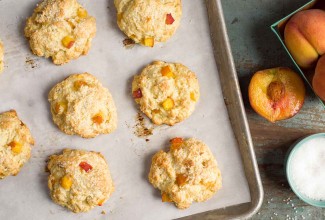 Tender Peach Scones on a baking sheet, fresh from the oven