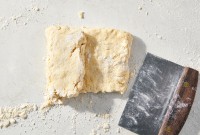 Biscuit dough being folded like a letter