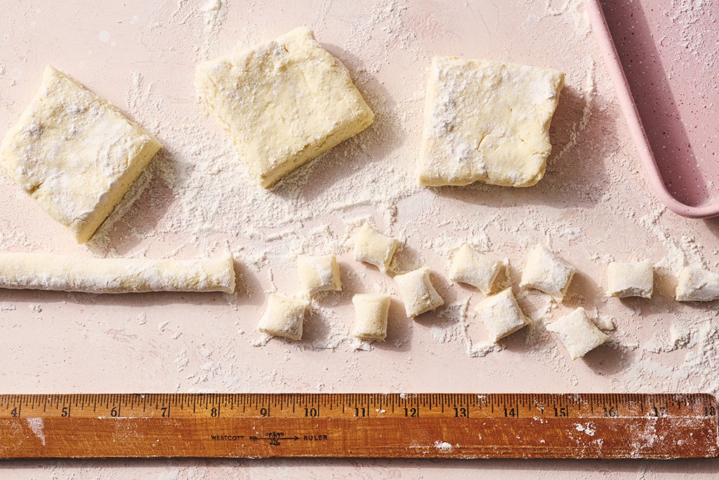 Rolled out gnocchi dough cut up