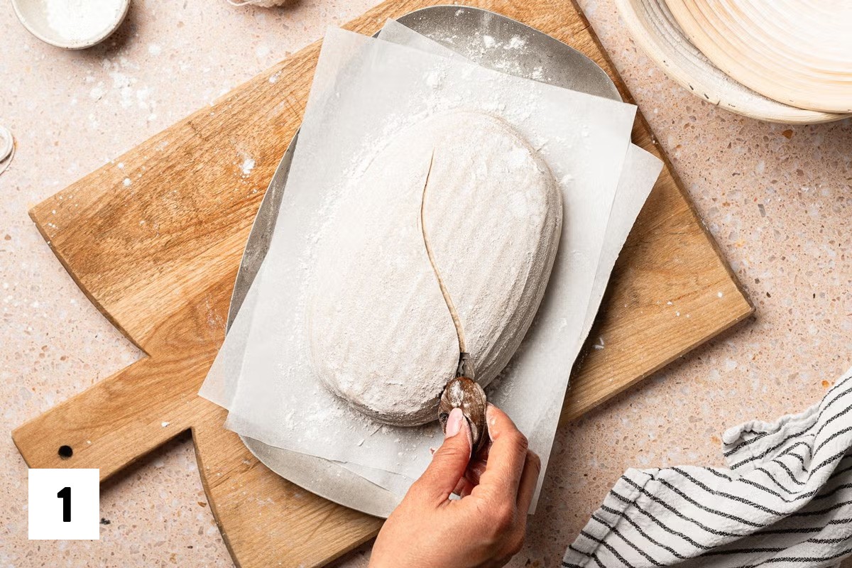 Sourdough bread dough with an S scored into it