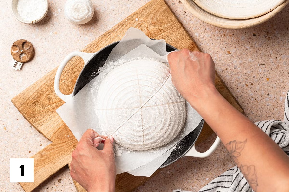 Using butcher's twine to divide a loaf of bread dough into 8 sections
