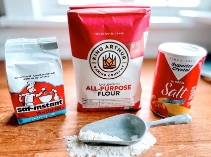 Bag of SAF instant yeast, bag of King Arthur Unbleached All-Purpose Flour, canister of Superior Crystal salt.