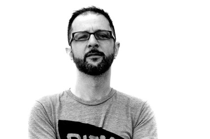 A headshot of Andrew Janjigian