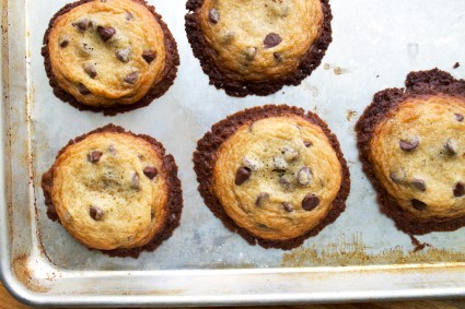 Chocolate chip cookies baked on a greased baking sheet