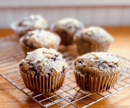 Blueberry muffins cooling on a wire rack.