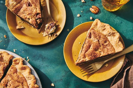 A few slices of Chocolate Chip Pecan Pie on plates with forks