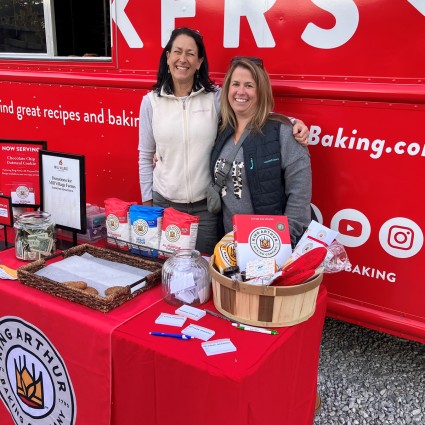 Bakers standing in front of King Arthur bake truck