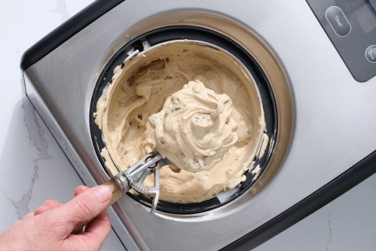 A scoop of ice cream straight from the bowl of the ice cream maker