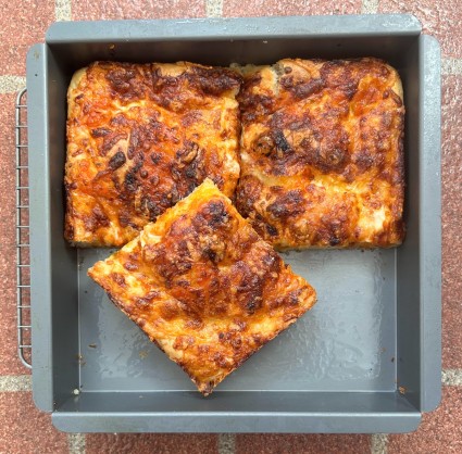 Cheese pizza recipe baked in a 9" x 9" focaccia pan, cut into squares.