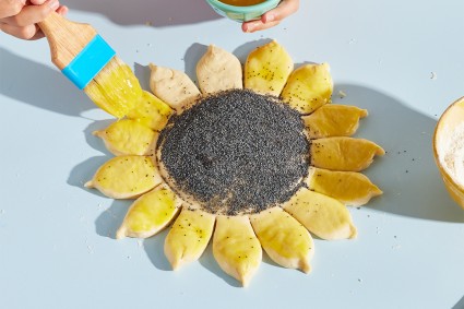 Sunflower Bread brushing on butter