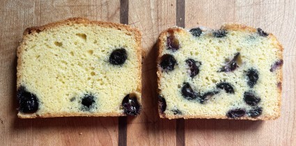 Two slices of blueberry bread, one with berries chopped, one using whole berries, showing the difference in dispersal.