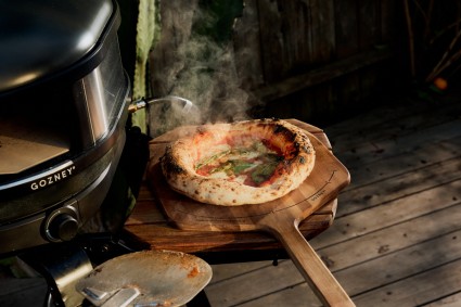 Neapolitan pizza on a pizza peel, straight from a Gozney pizza oven