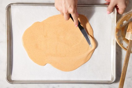 Spreading thin batter with an offset spatula