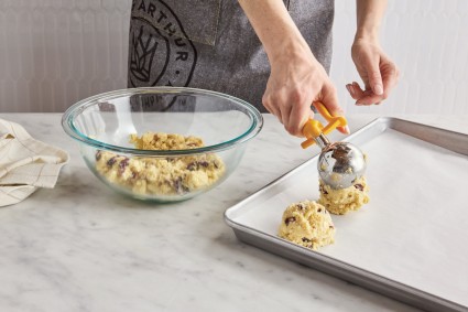 Scooping scone dough with kitchen scoop
