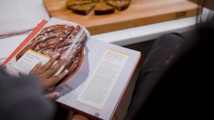 Kid paging through Sweet & Salty!