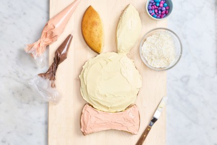 Partially decorated Easter bunny cake