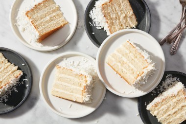 Slices of Coconut Layer Cake on plates