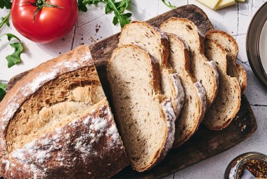 Caraway Rye Bread sliced on a cutting board