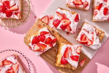 Giant Strawberry Shortcake sliced on a cutting board