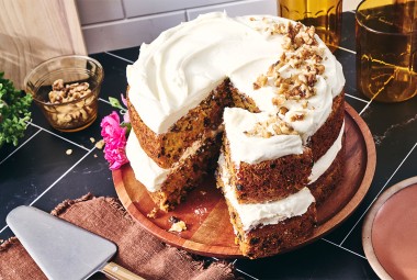 Gluten-Free Carrot Cake with Cream Cheese Frosting with a slice cut out