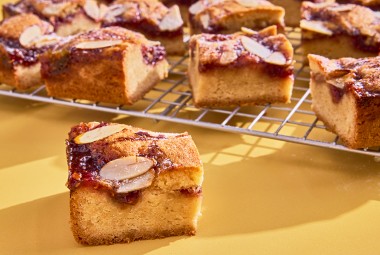 Raspberry Frangipane Bars sliced on a cooling rack