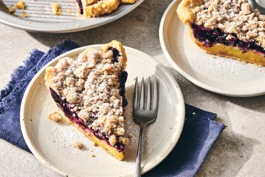 A slice of Lemon-Blueberry Streusel Pie on a plate