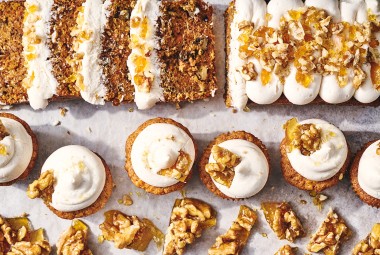 Spiced Carrot Snacking Cake shown as a sliced cake as well as cupcakes.