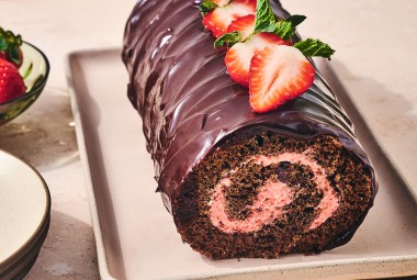 Chocolate Strawberry Roll Cake on a sheet pan