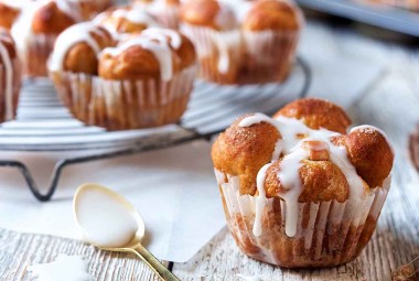 Glazed Cinnamon Apple Pull-Apart Rolls, fresh from the oven on a plate.